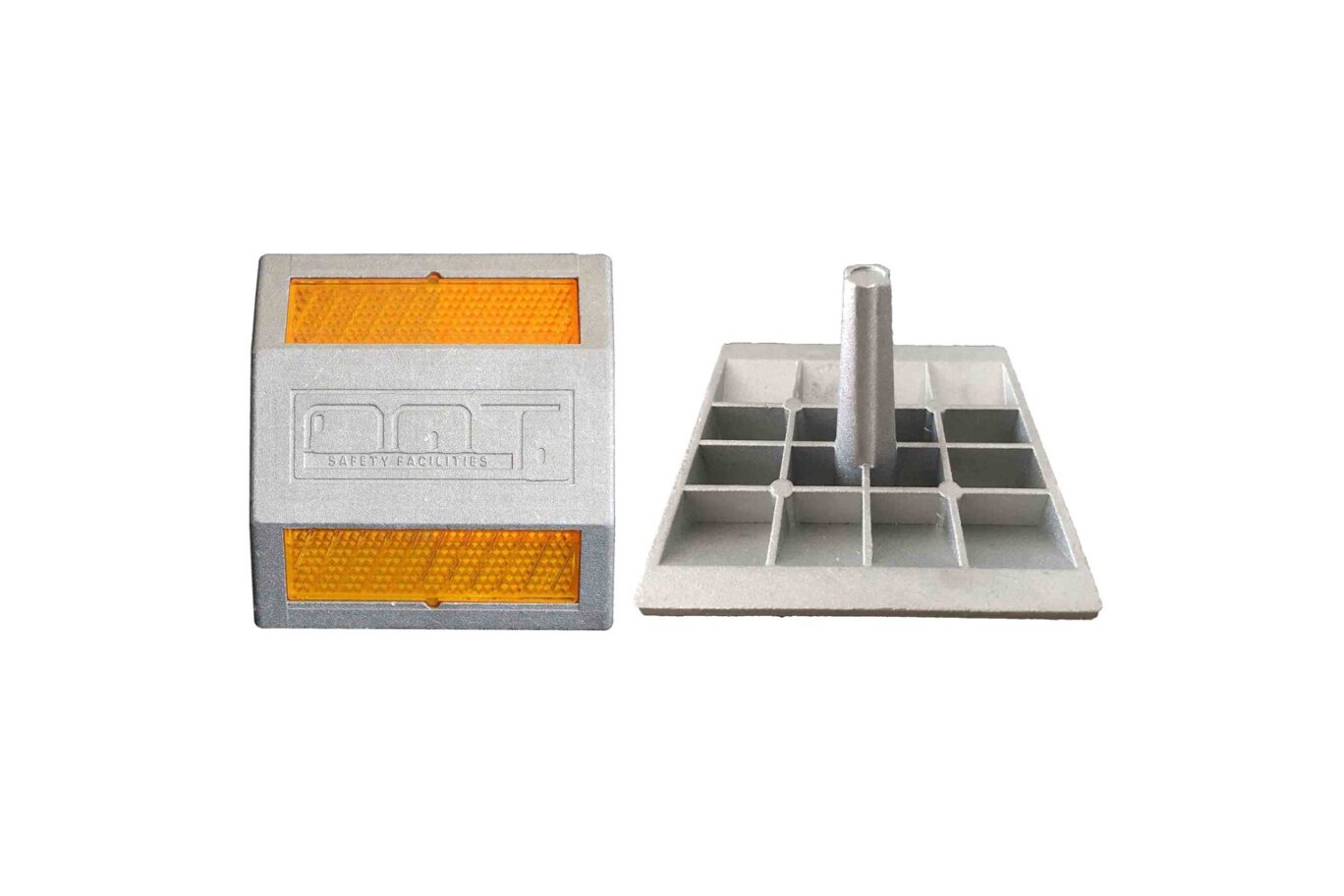 Aluminum road stud with amber reflective panels and underside shank for anchoring