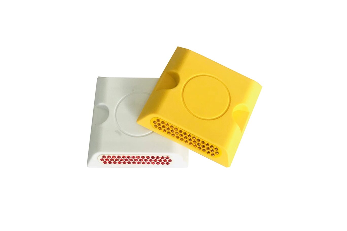 White and yellow plastic road studs with multiple reflective lenses for pavement guidance